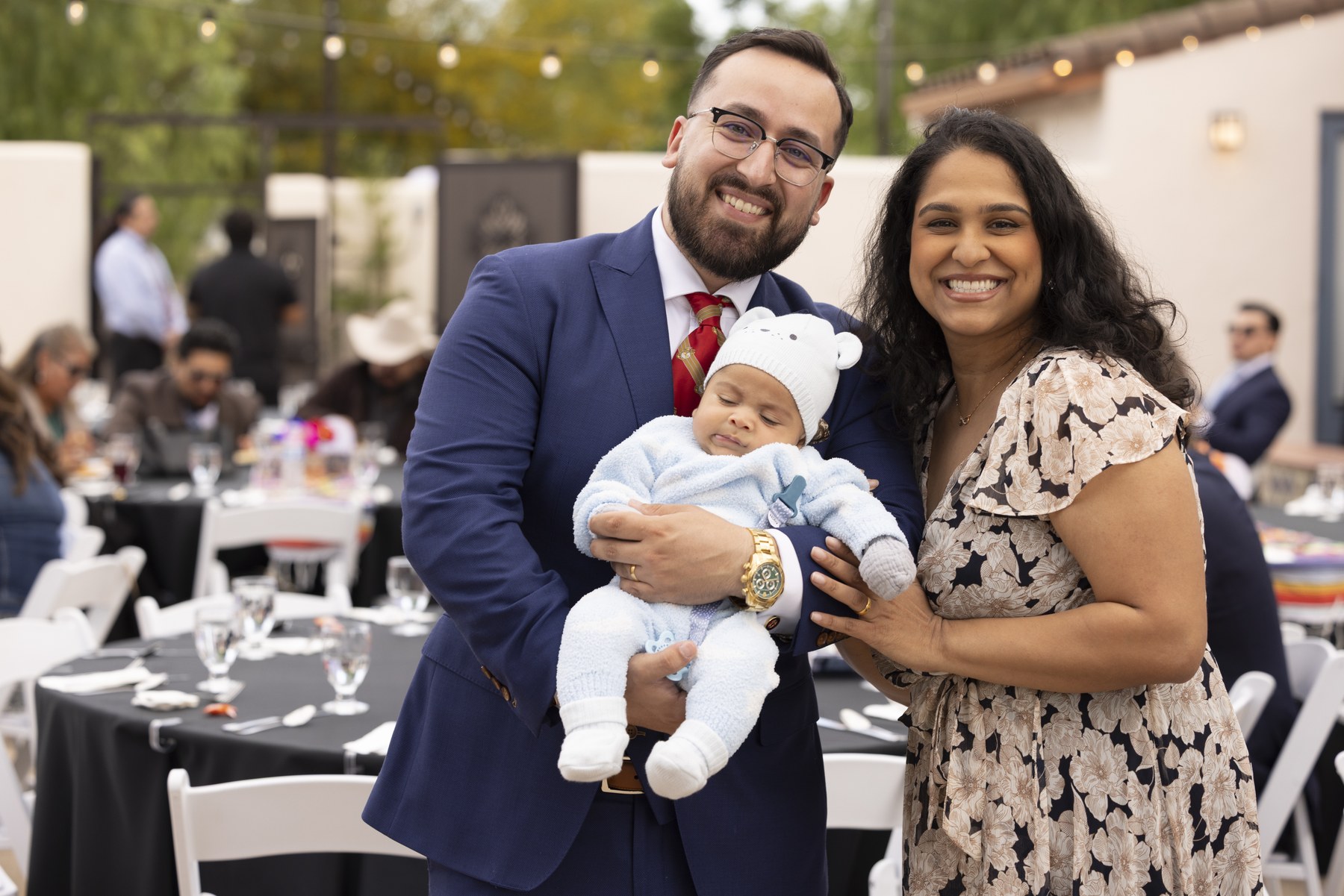 James Burandt with his wife and infant son at a community gathering